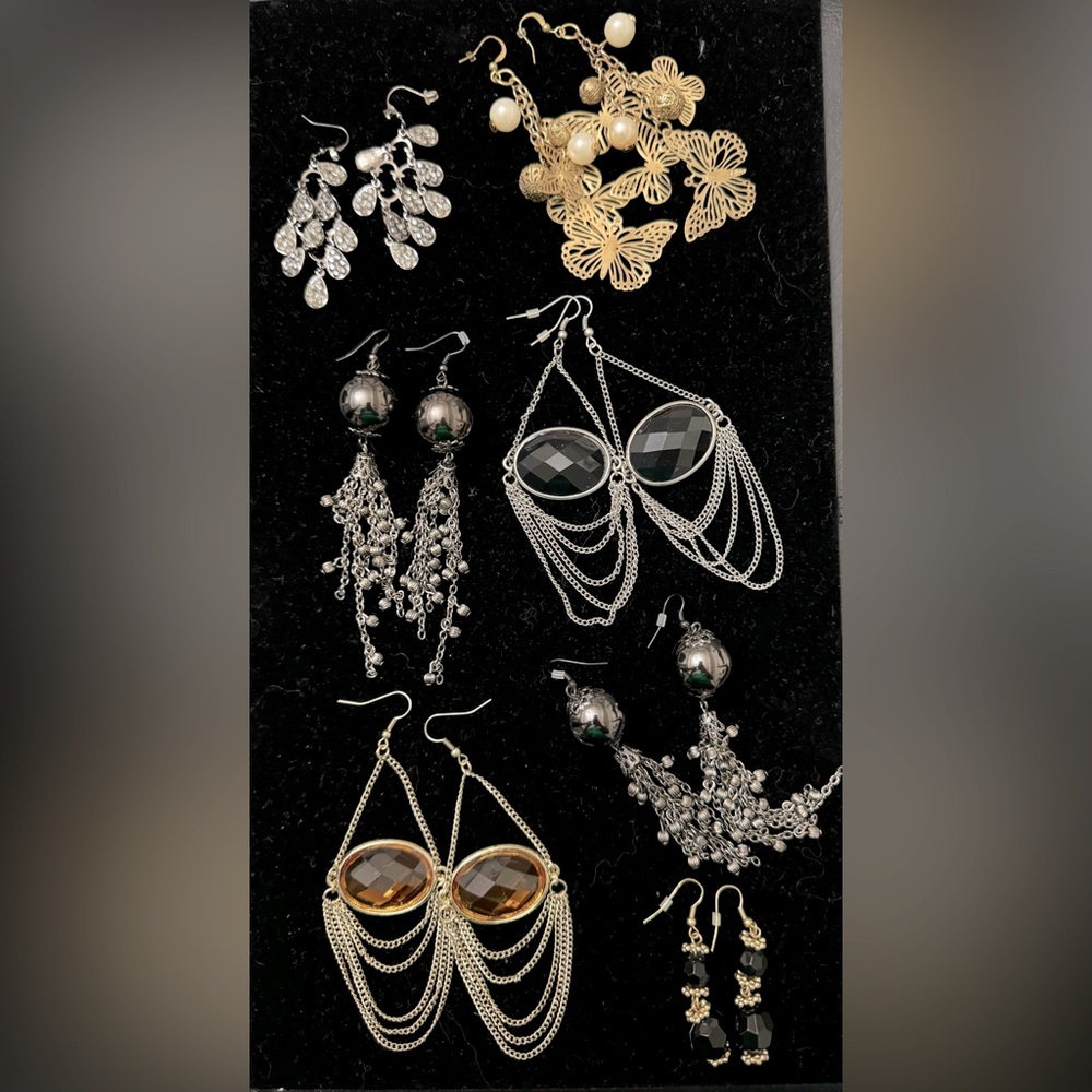 Lot of 8 pairs of dangly earrings. New, with no tags